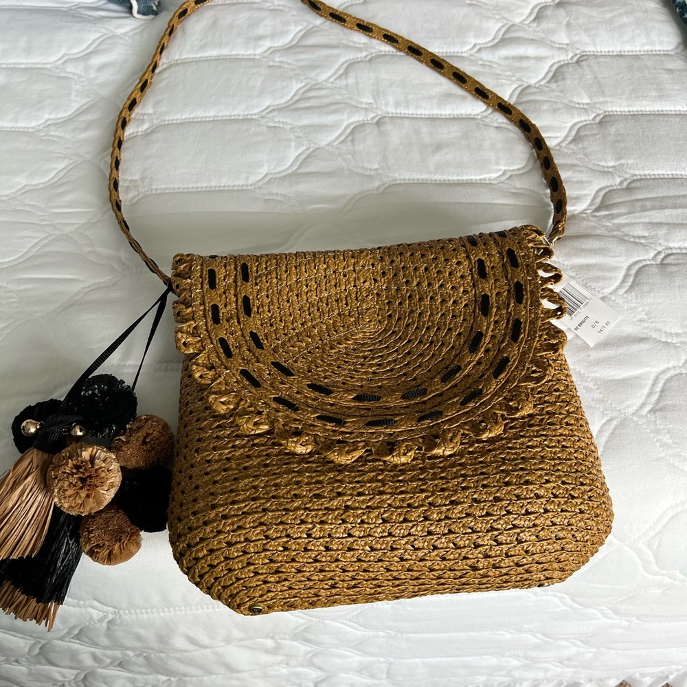 Eric Javits Brigitte squishee straw crossbody.  Adorable.